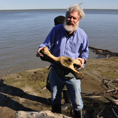 George Church in the field with wolly Mammoth Bone